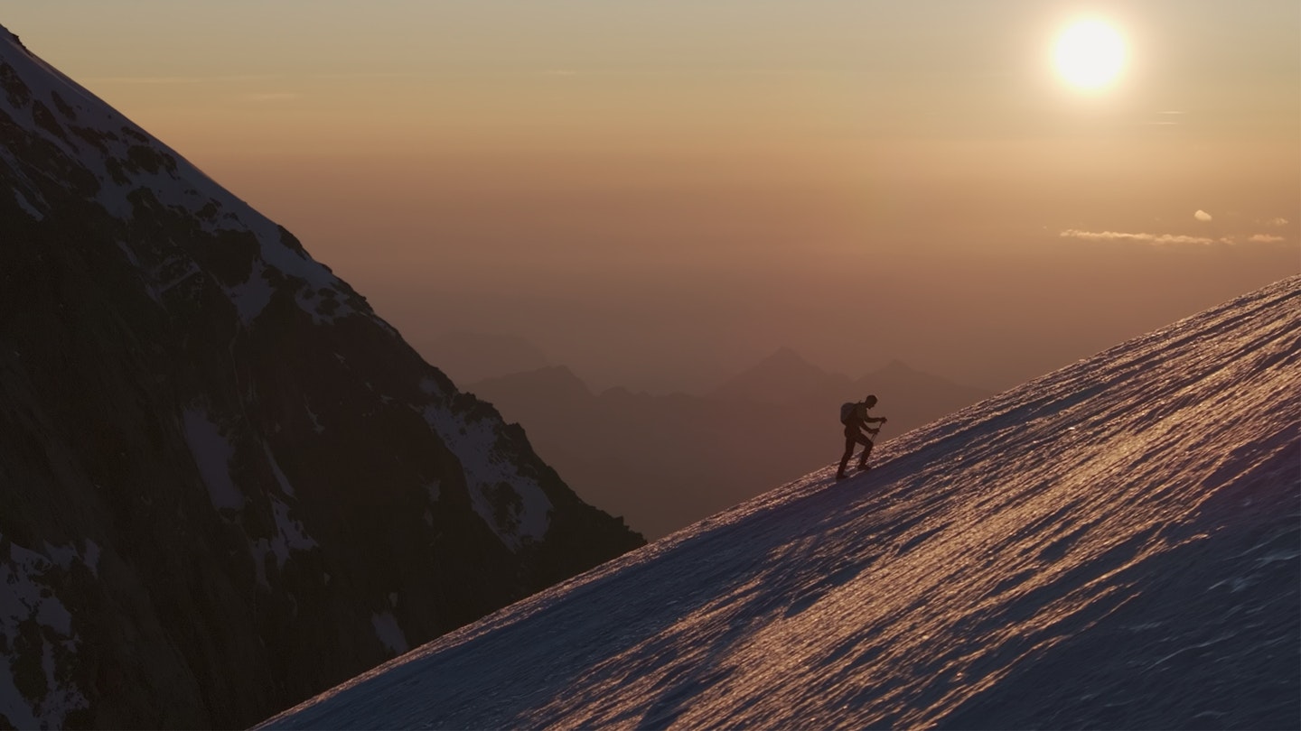 Alex Steindl iclimbing on snowy paths on alpine peaks of the Spaghetti tour