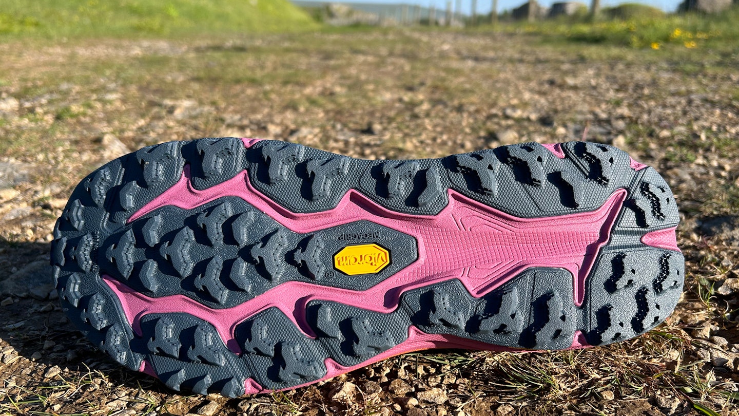 Lugs under Hoka speedgoat 6 trail running shoe on gravel