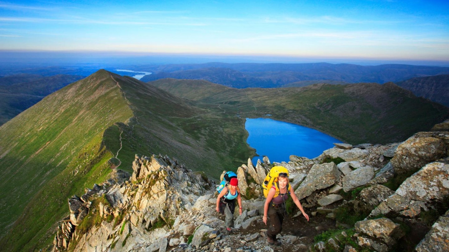 Two women scramble Swirral Edge