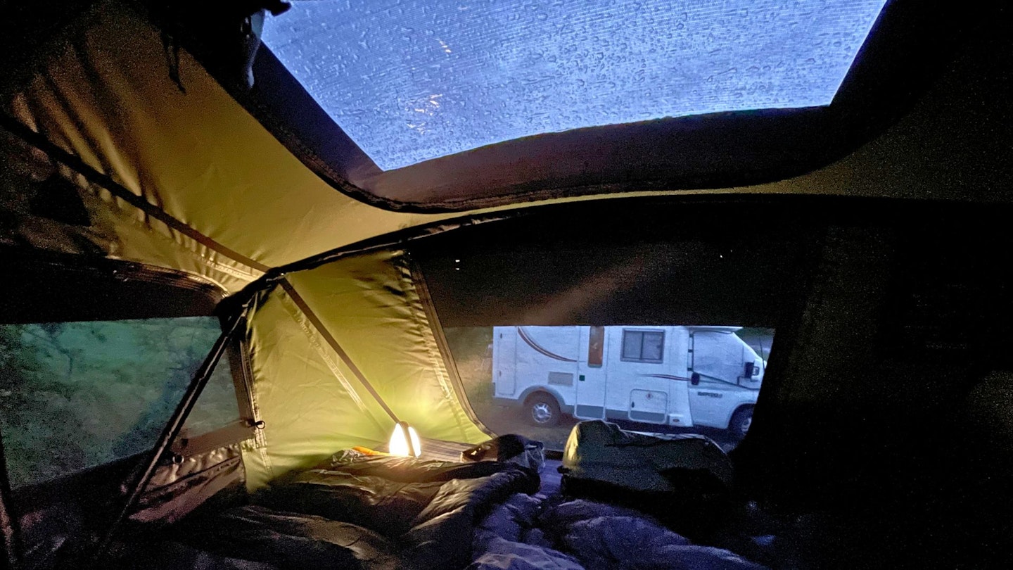 Inside a TentBox roof tent on a rainy night