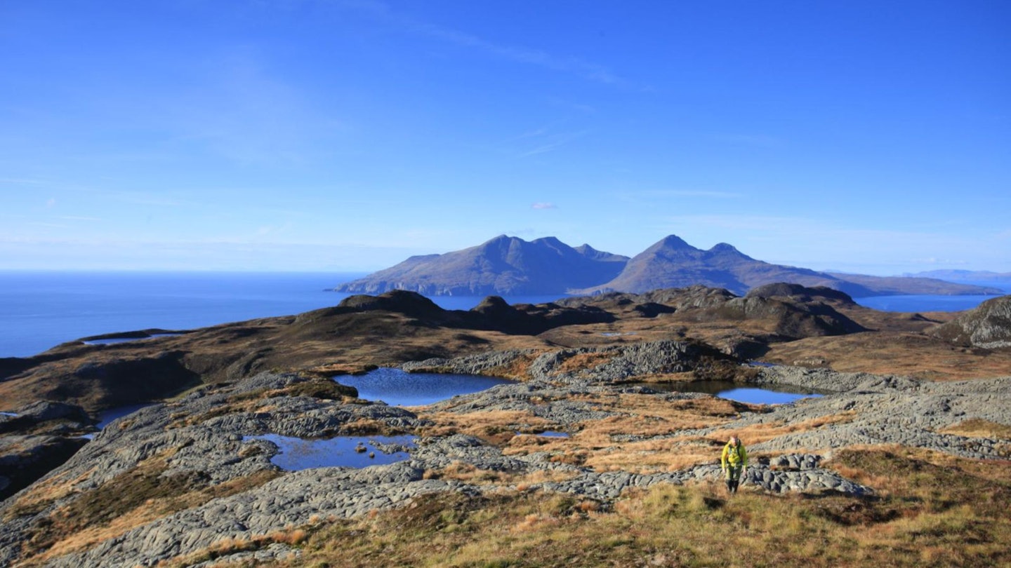 Exploring An Sgurr Eigg looking North to Rum Scotland