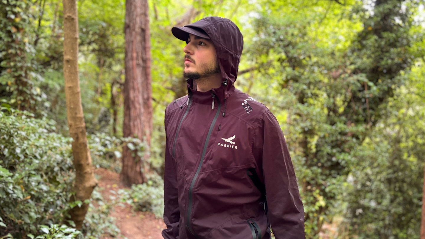 Harrier Exmoor waterproof trail running jacket being tested in the woods 