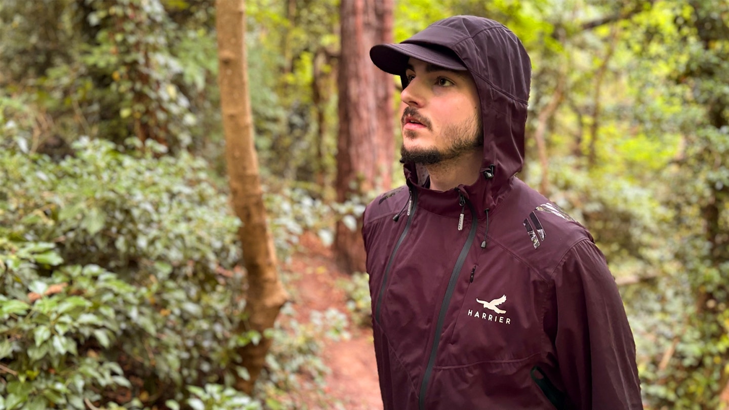 Harrier Exmoor waterproof trail running jacket being tested in the woods