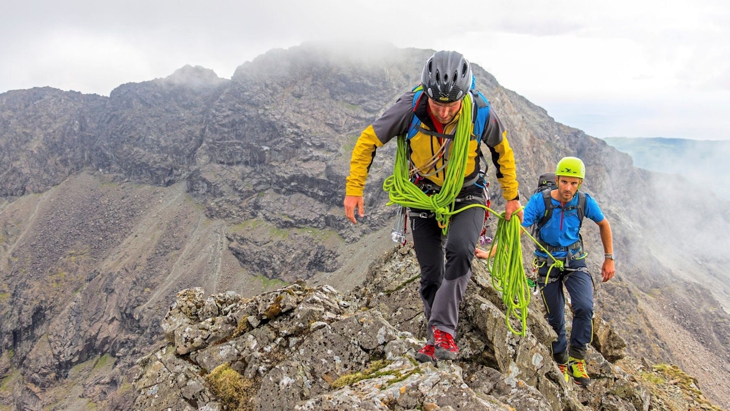 Hikers mountaineering on the Cuillin Ridge Isle of Skye