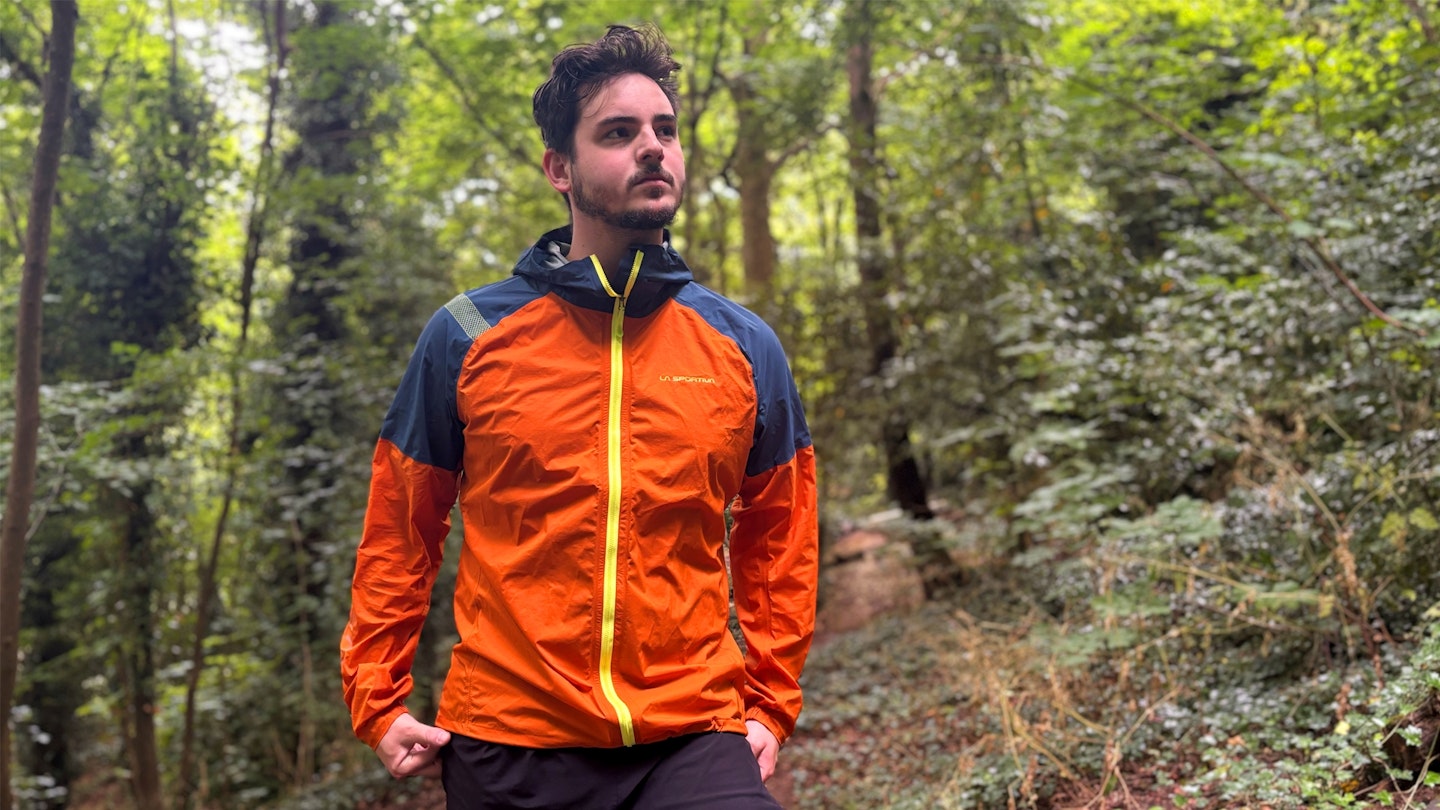 La Sportiva Pocketshell waterproof running jacket being tested in the woods 2