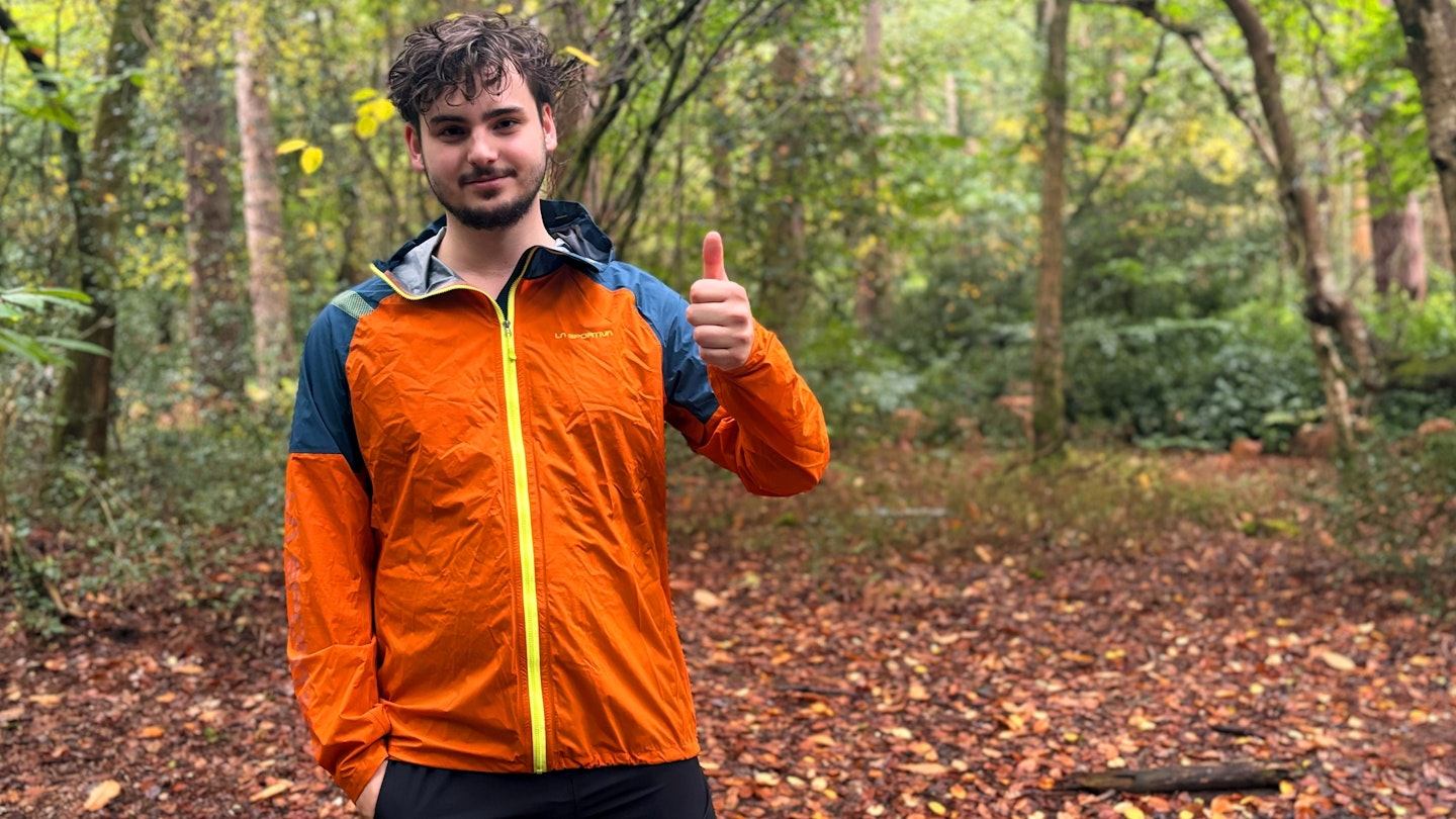 La Sportiva Pocketshell waterproof running jacket being tested in the woods 4