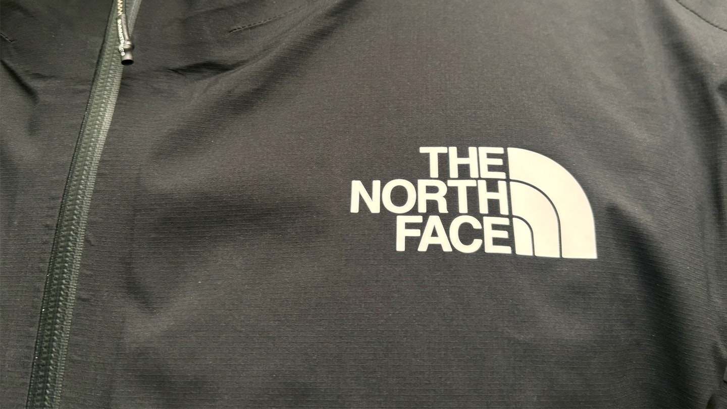 Logo on the north face summit superior futurelight waterproof running jacket