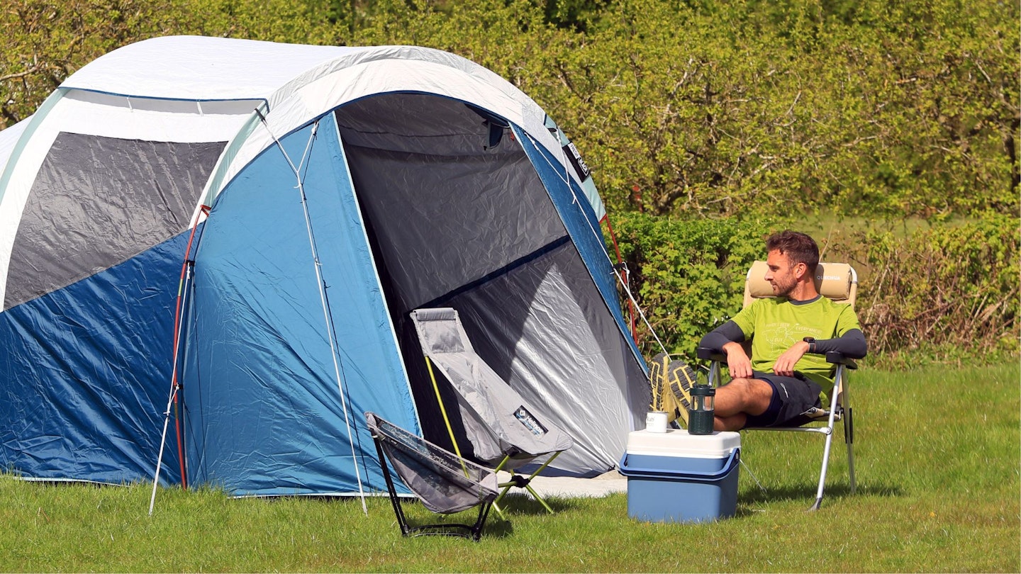 Member of the Live for the Outdoors team testing Bluetooth camping speakers