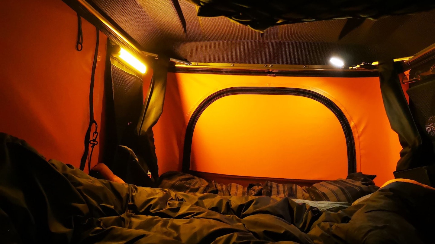 TentBox Classic interior at night with lightbar