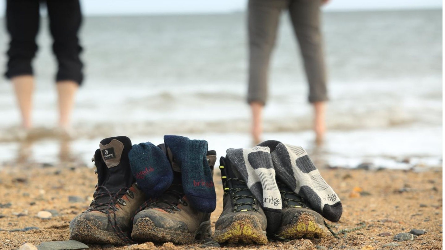 Bridgedale socks in hiking boots on beach