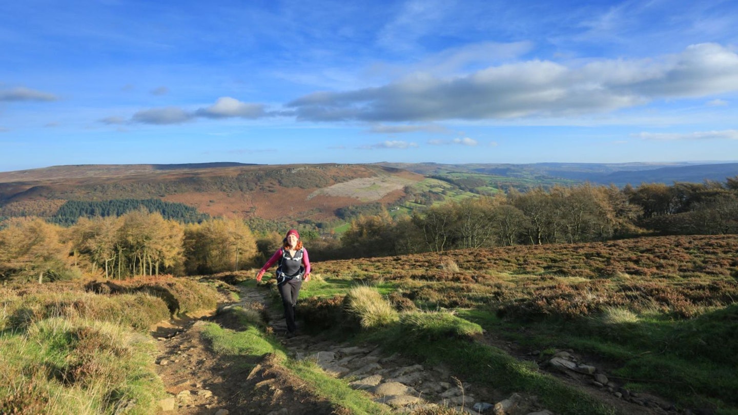 Female hiker climbing Win Hill in the Peak District