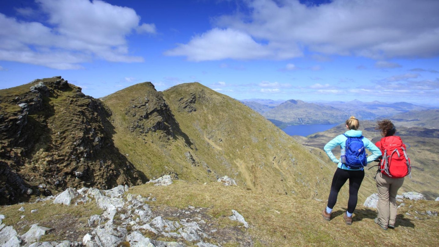 Female hikers hiigh on Ben Lomond Summit ridge in the Scottish Highlands