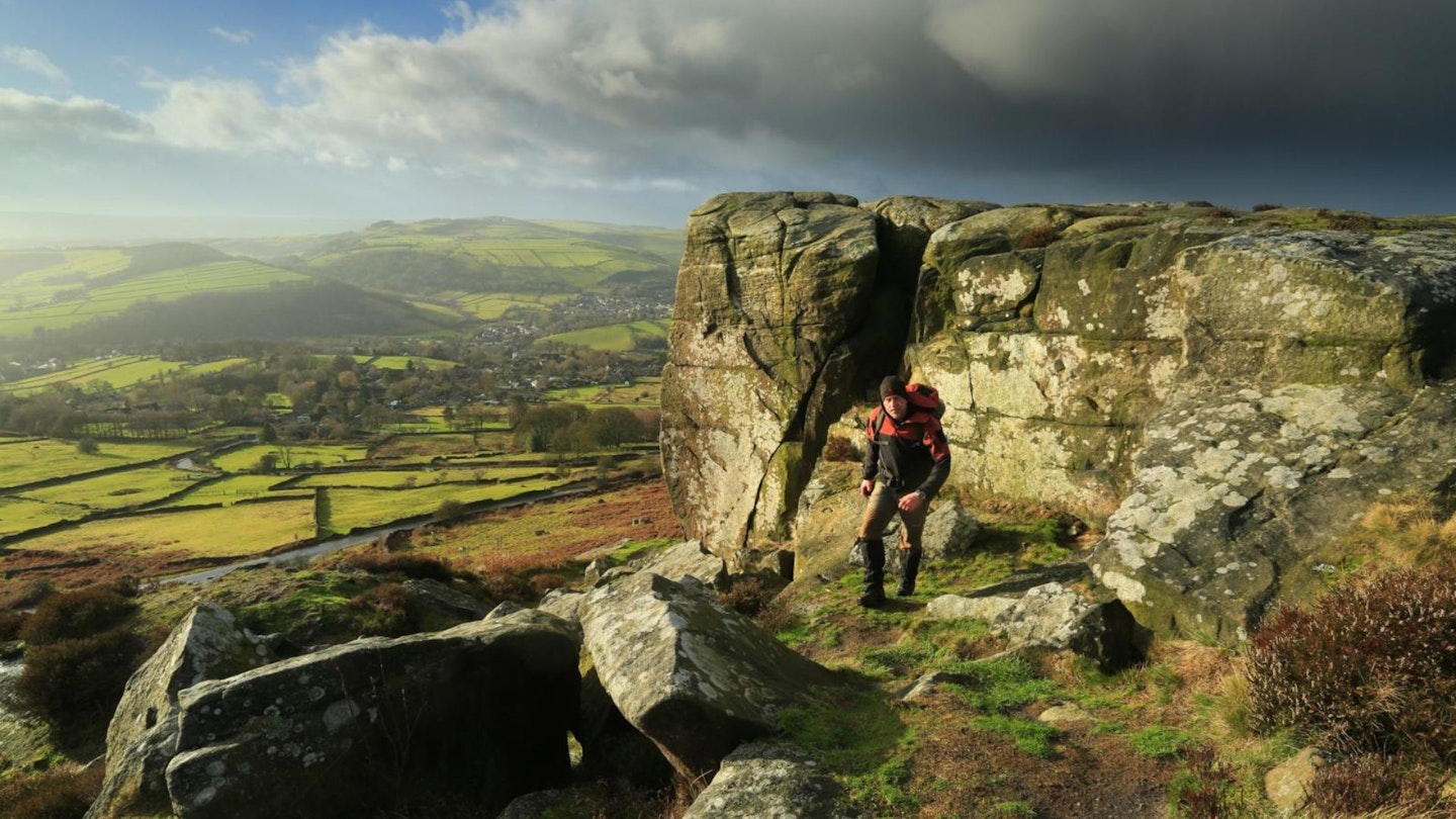 Walker near the southern end of Curbar Edge in the Peak District