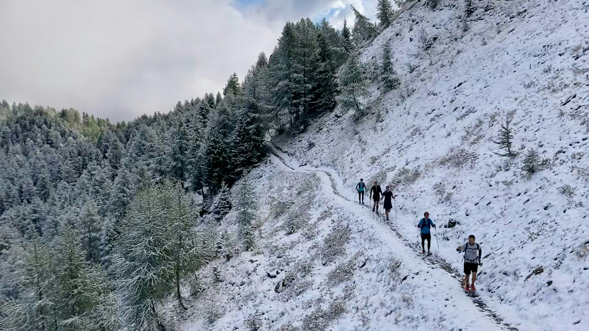 trail running on snowy mountain paths