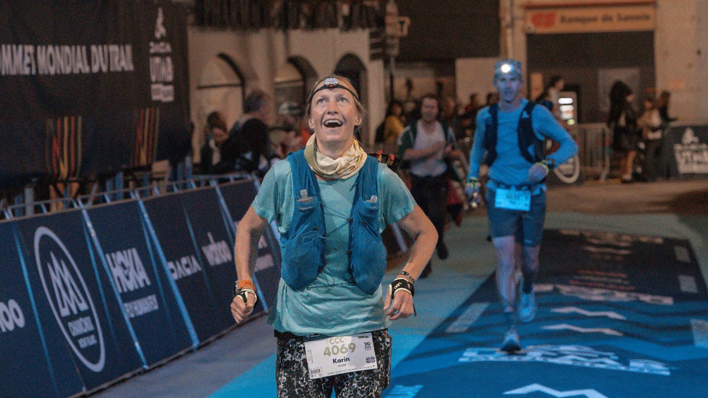 female trail runner at UTMB finish line