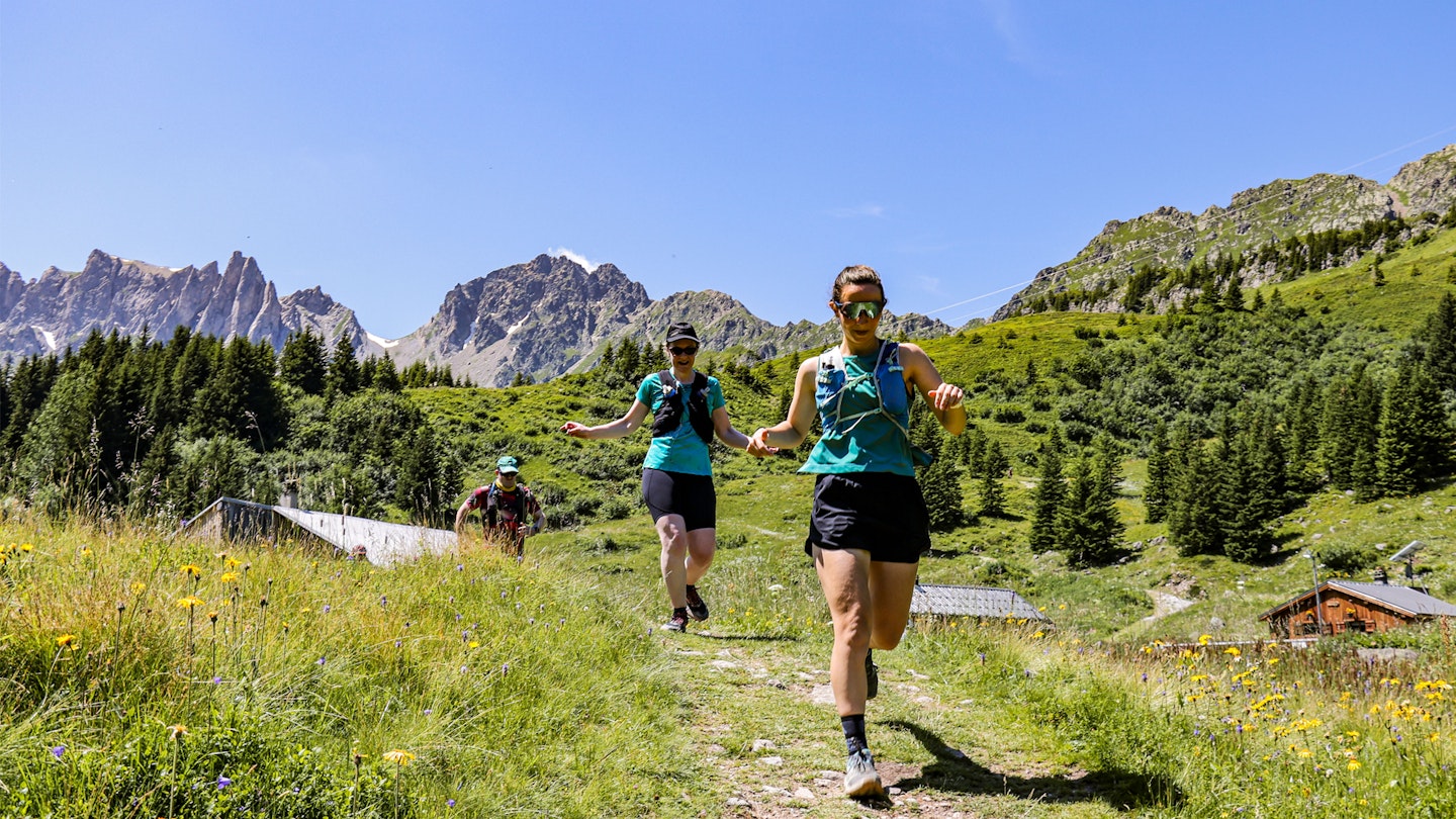 female trail runners on alpine paths