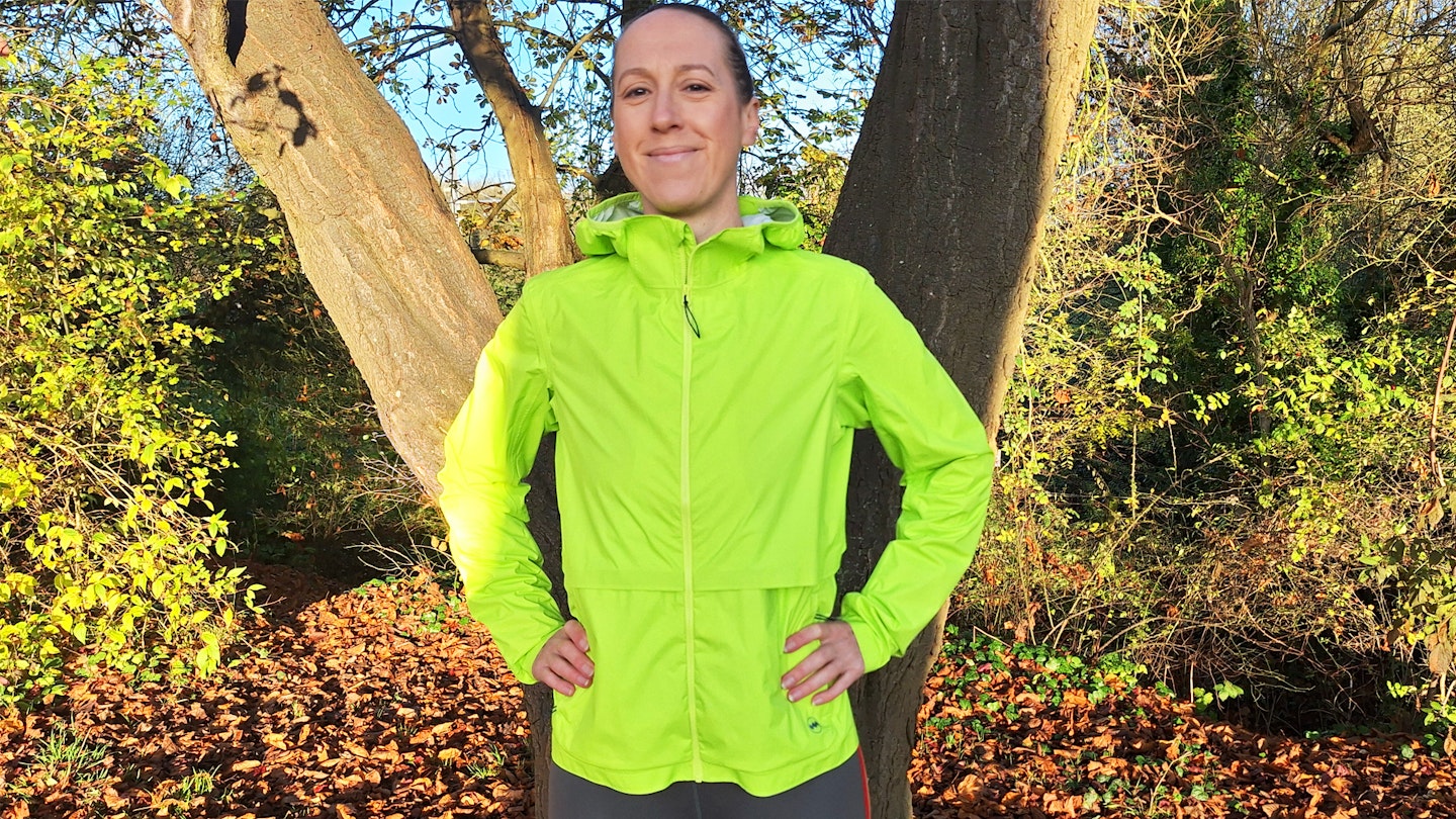 All smiles in the Janji Rainrunner waterproof jacket