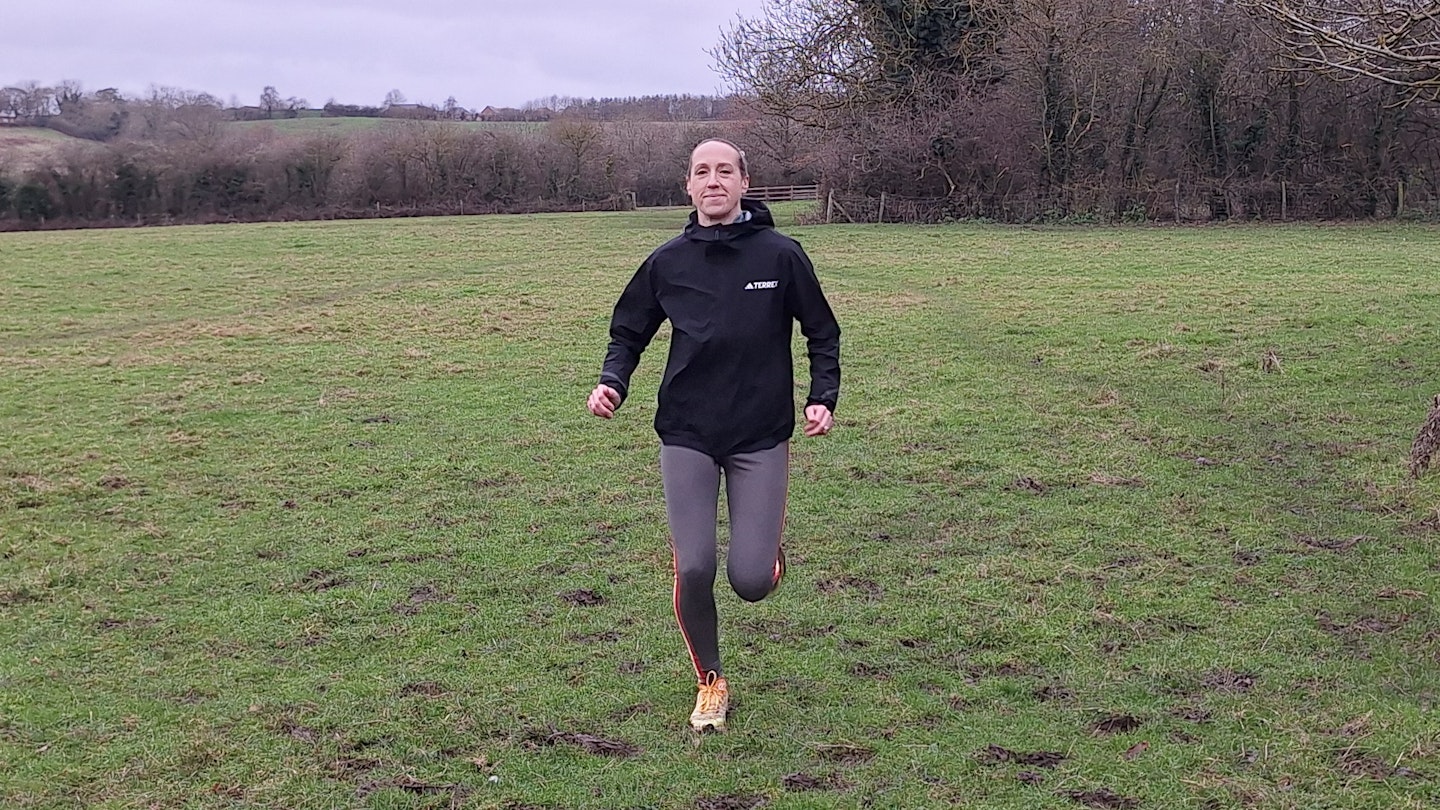 LFTO gear tester Lily Canter running while wearing the Terrex rain rdy jacket