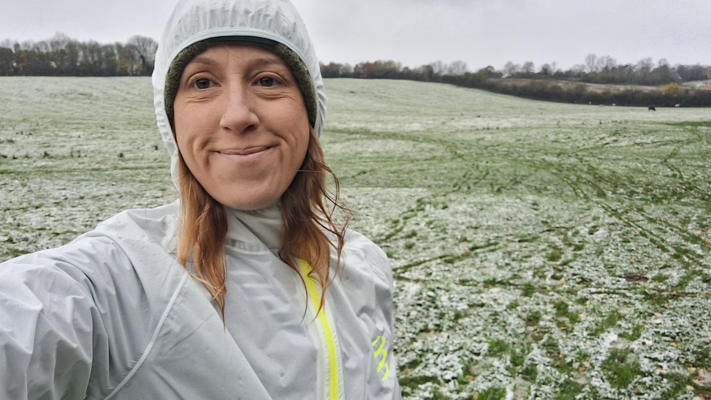 LFTO gear tester Lily Canter wearing the compressport hurricane waterproof running jacket