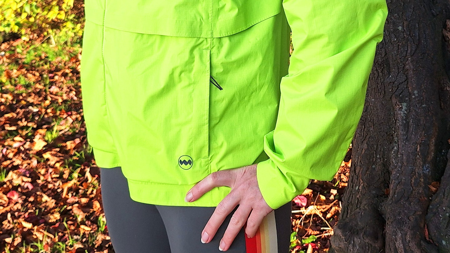 side pockets of the Janji Rainrunner waterproof jacket