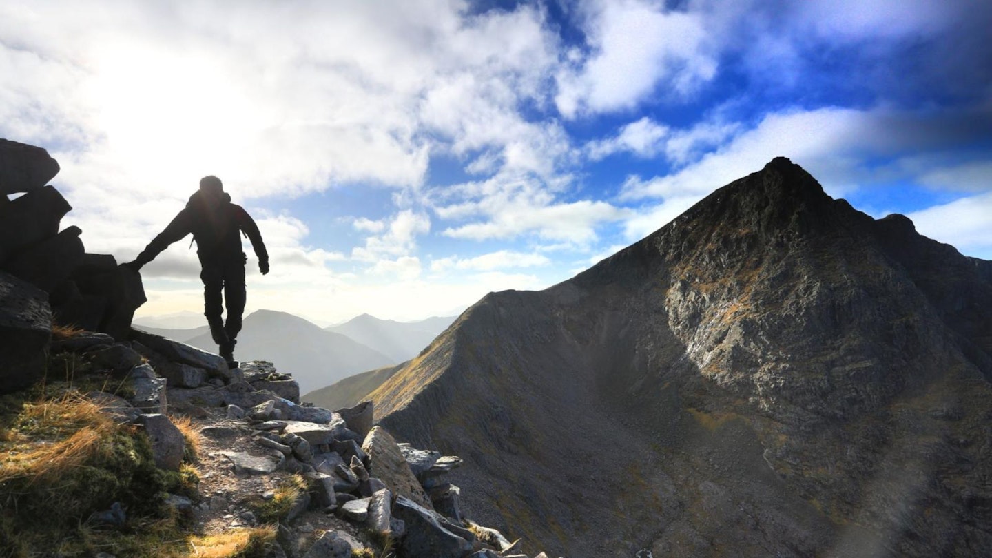 Hiker on Ben Nevis, seen from Carn More Dearg