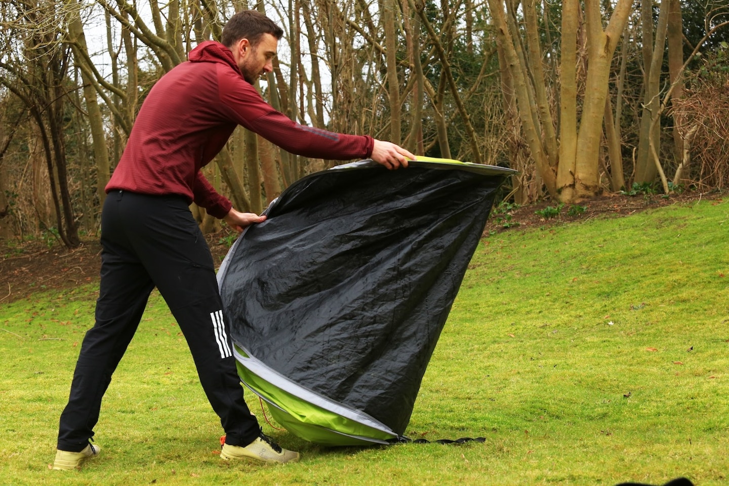 Folding a pop-up tent into a burrito shape