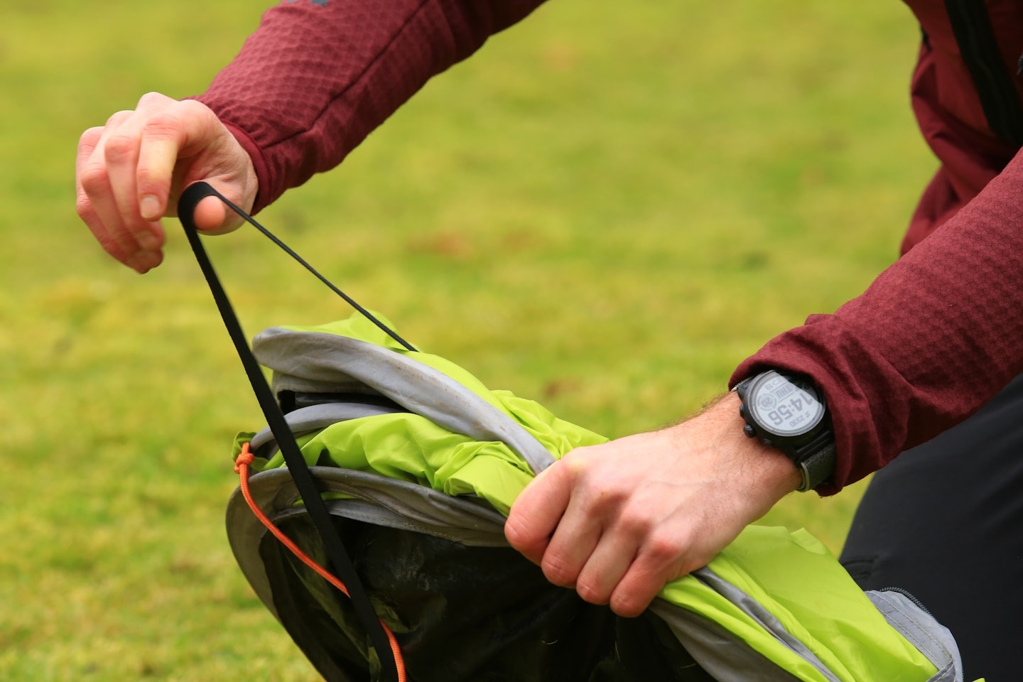 Putting a strap over your pop-up tent