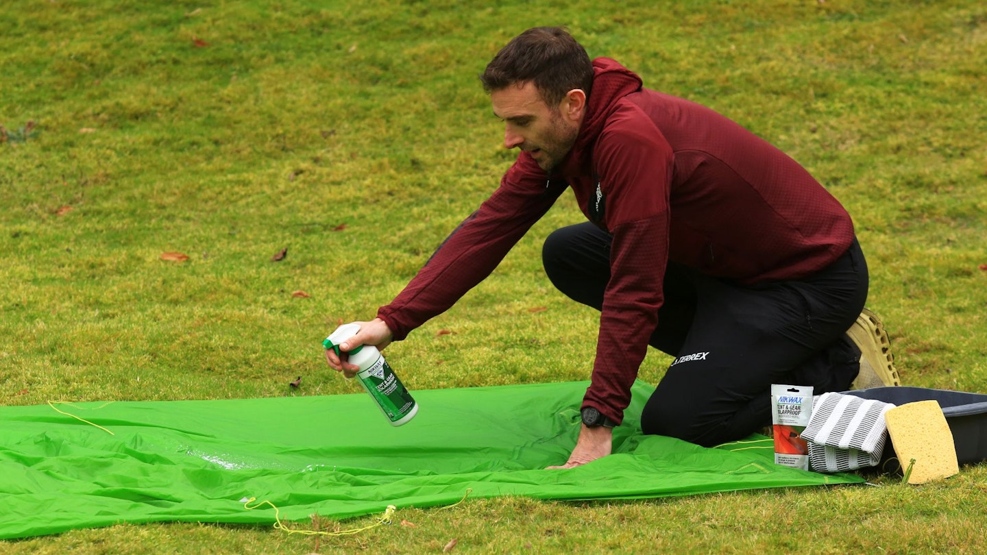 Reproofing a tent fabric