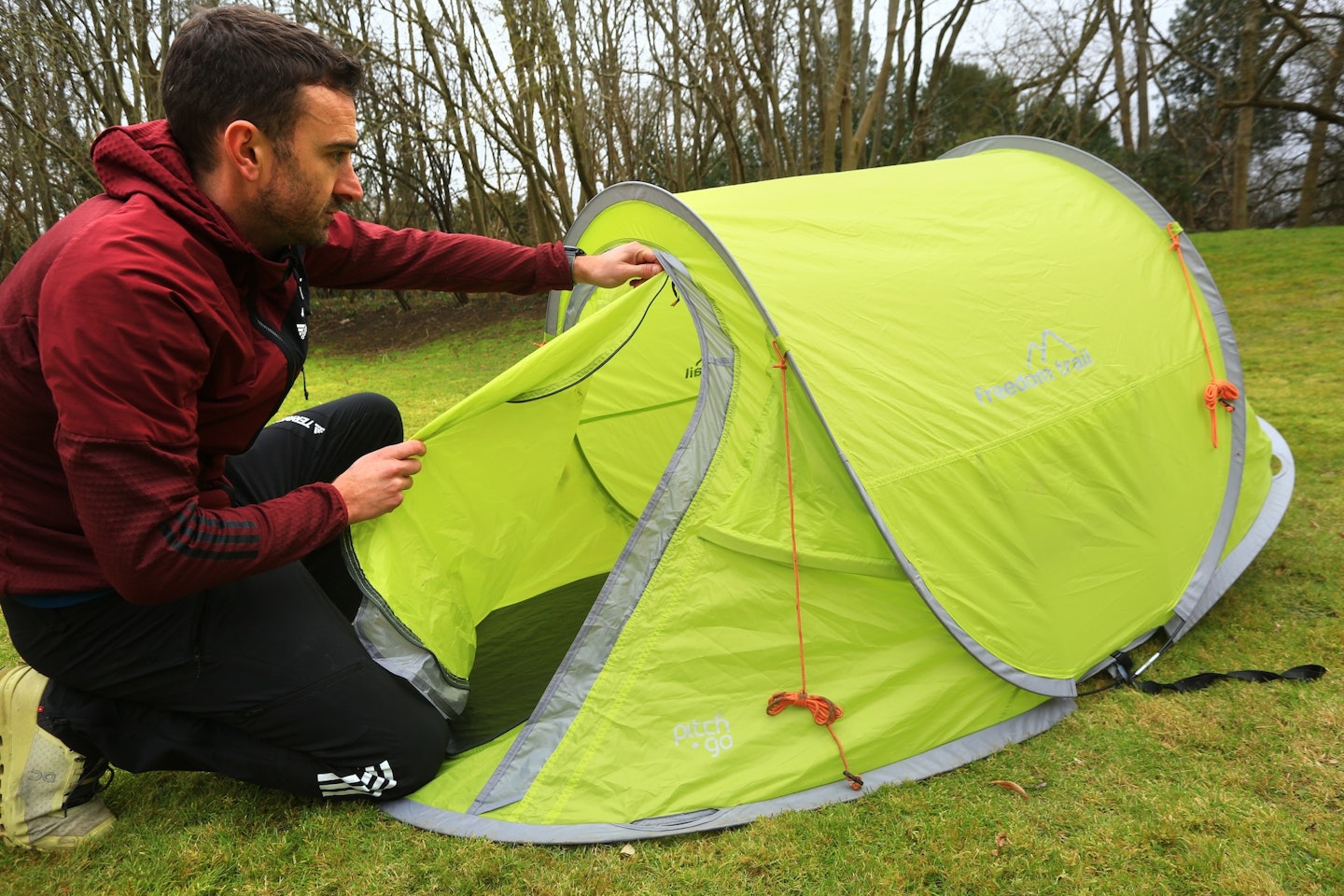 Unzipping a pop-up tent