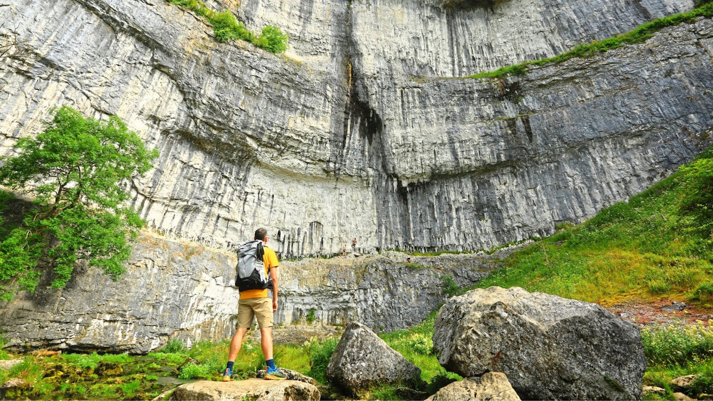 Walker at Malham Cove Malham Yorkshire Dales