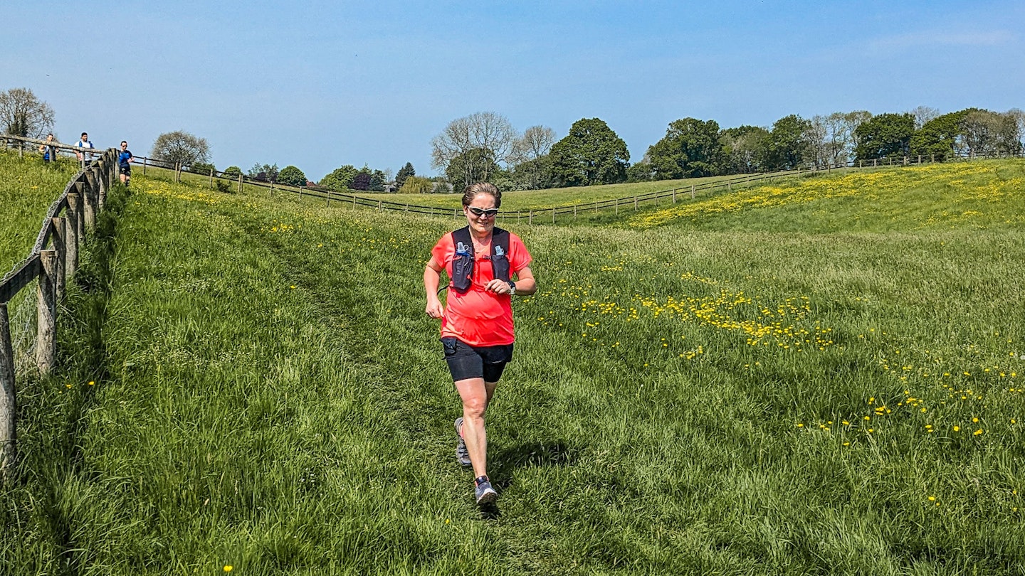 runner in a meadow