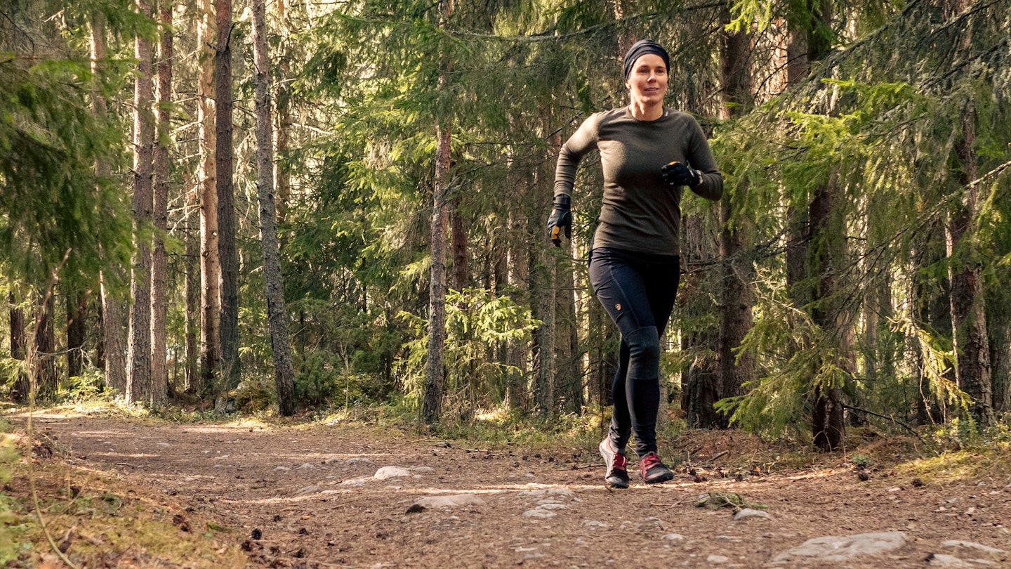 woman running in woolpower