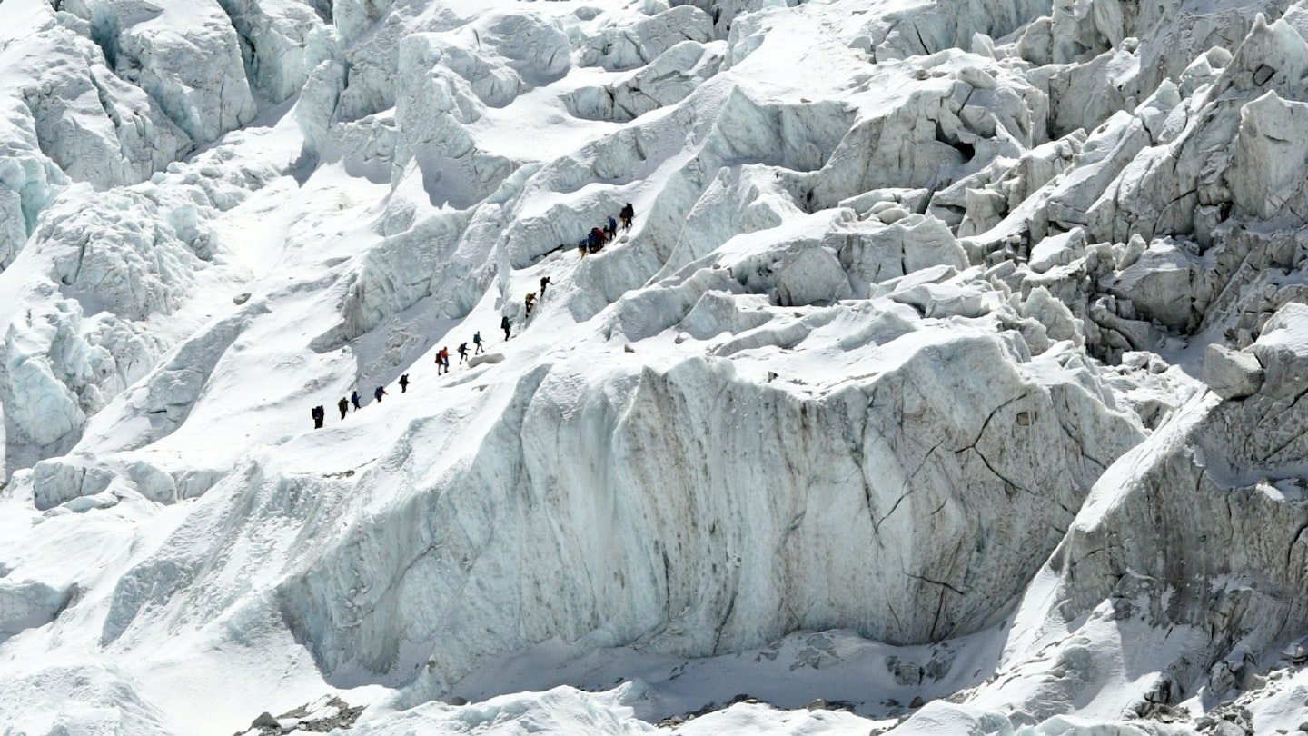Climbers cross the Khumbu Icefall on Mount Everest