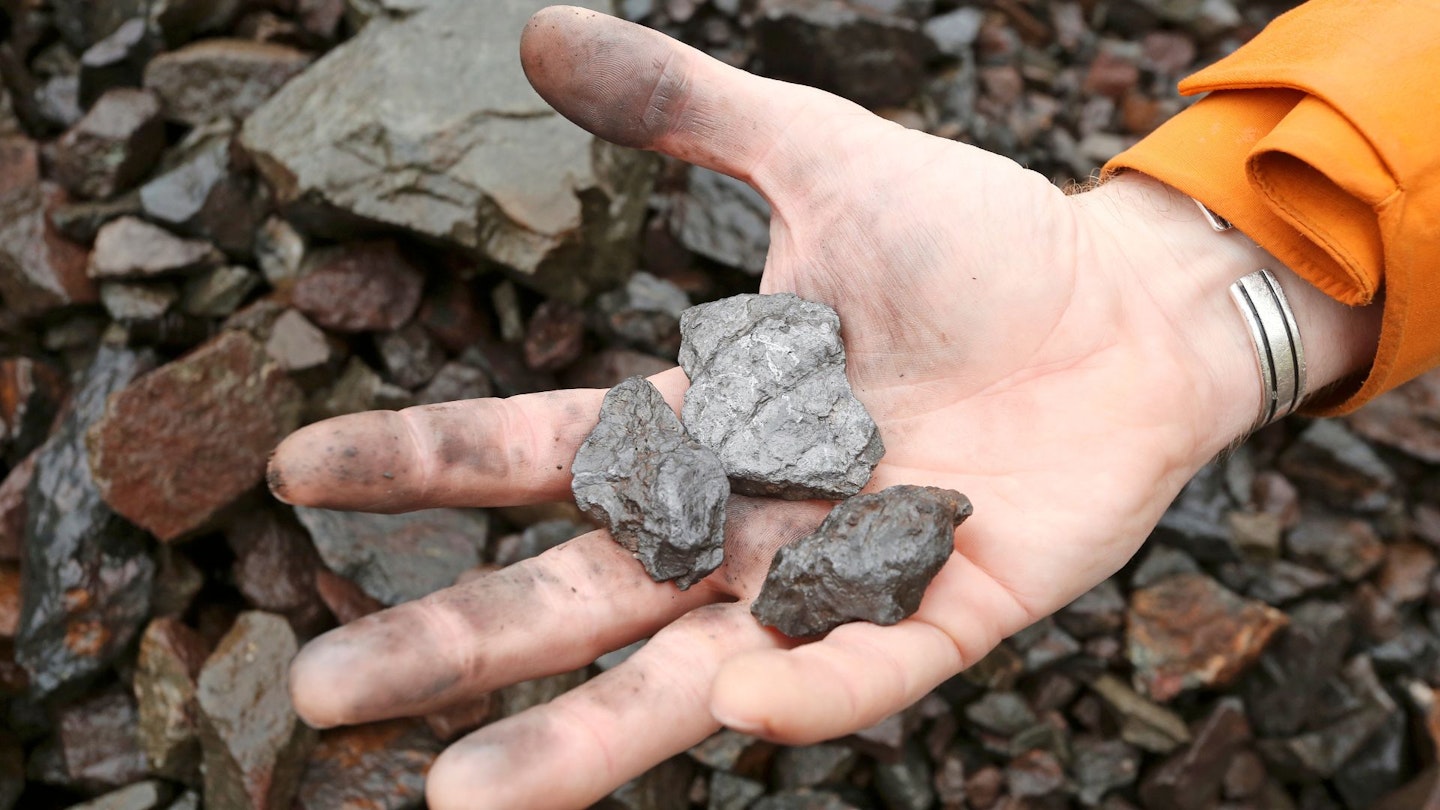 Ben holding some small graphite rocks