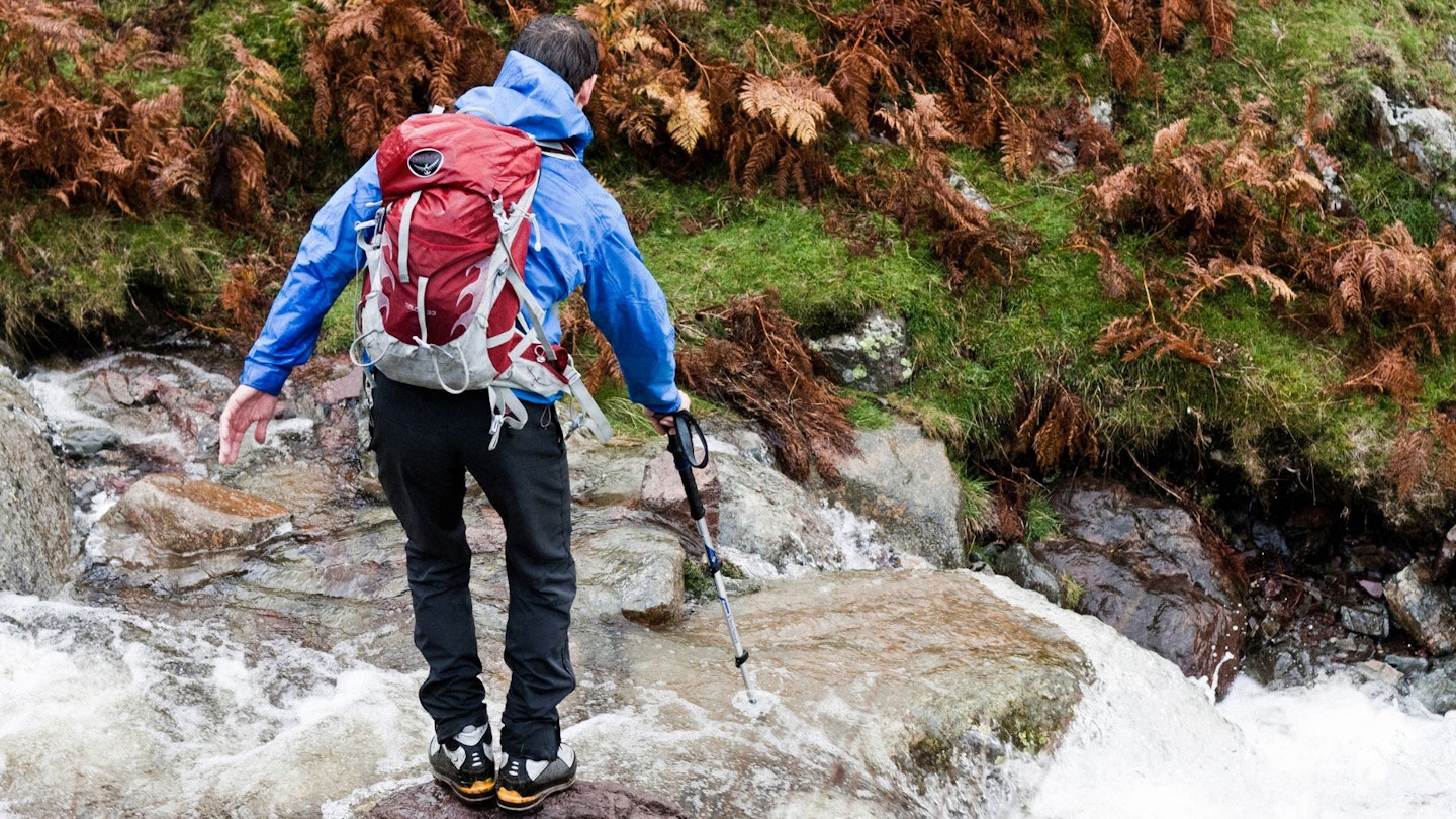 Kenton Cool crossing a stream
