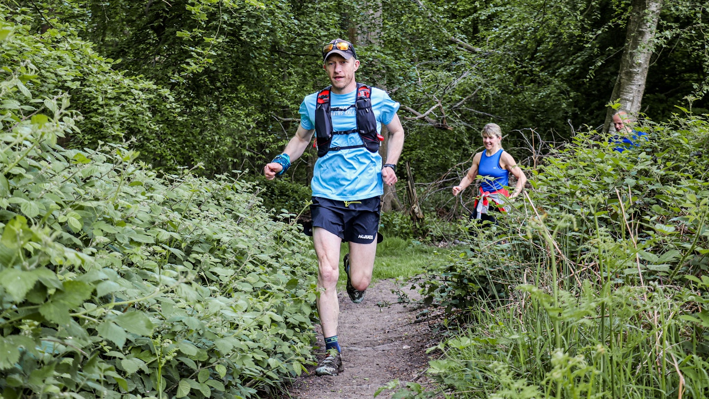 trail runner in the woods