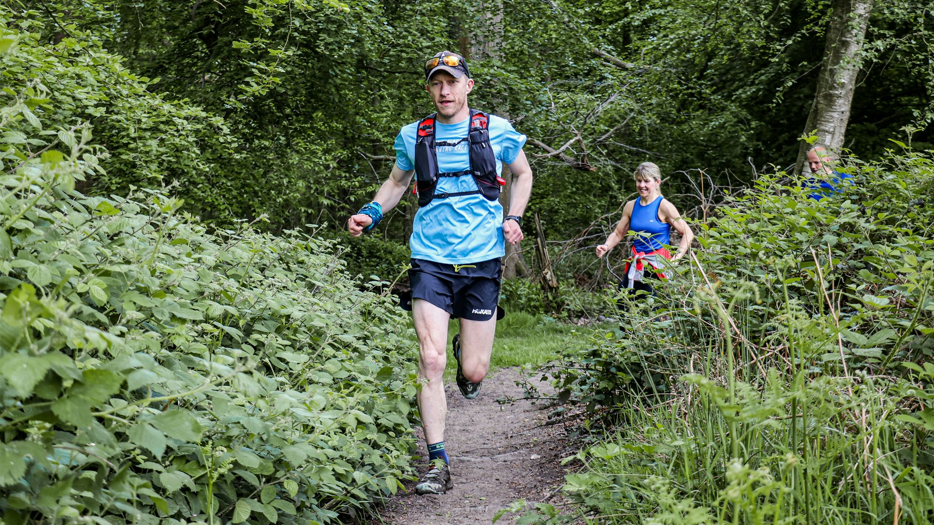 trail runner in the woods