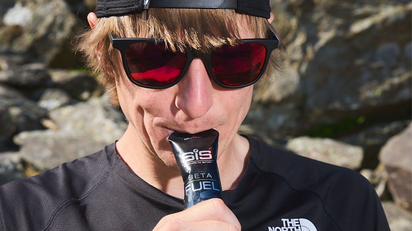 Josh eating an energy gel from SIS