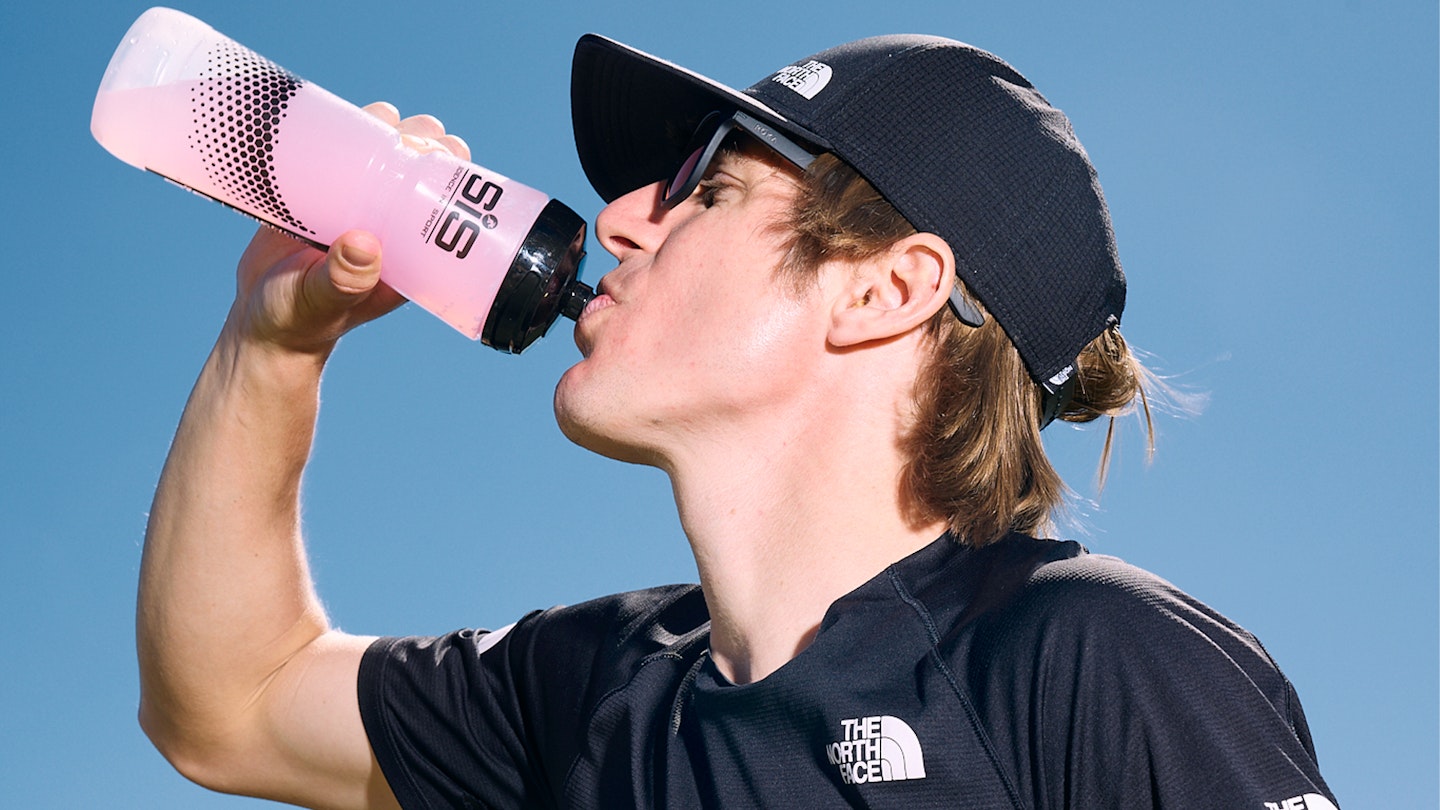 Josh wade drinking his carb drink from SIS