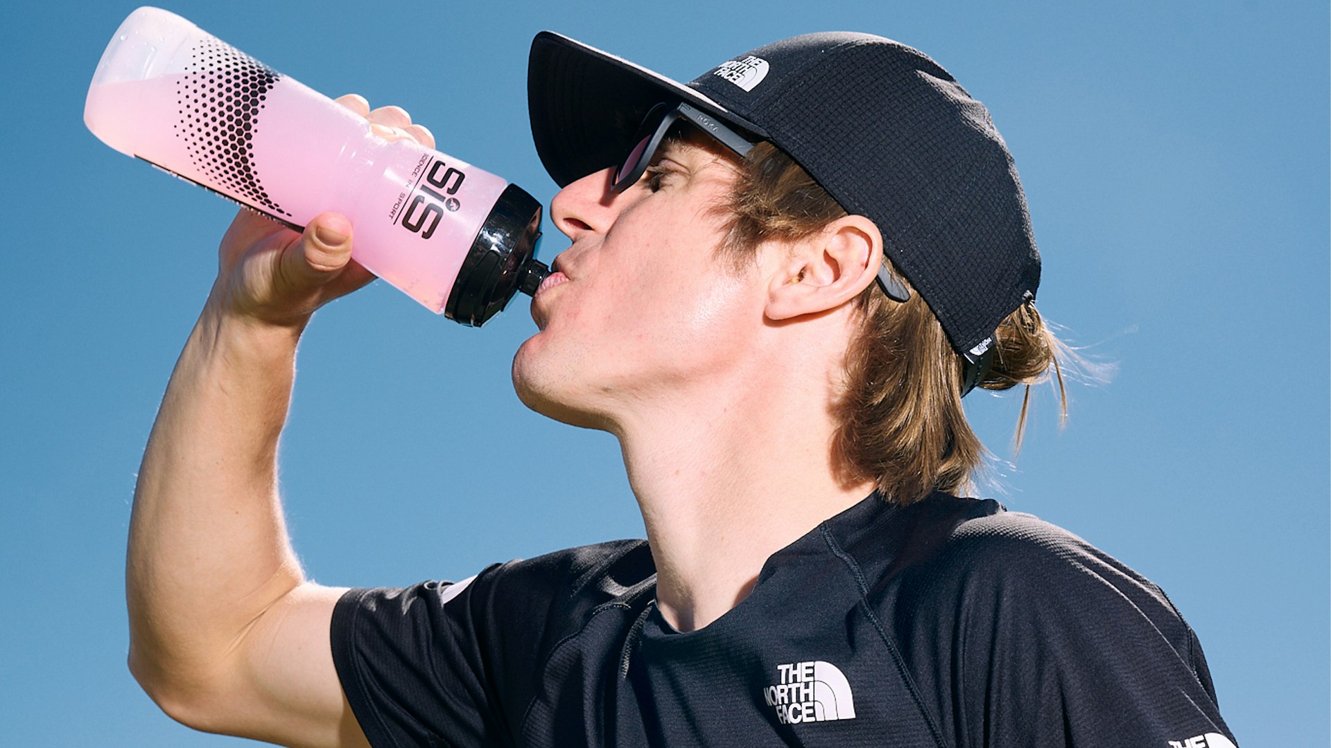 Josh wade drinking his carb drink from SIS