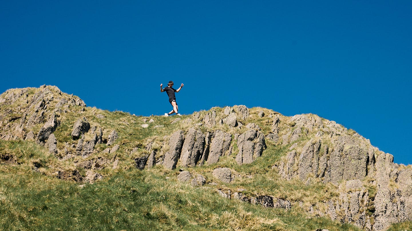 Josh wade running across rocks