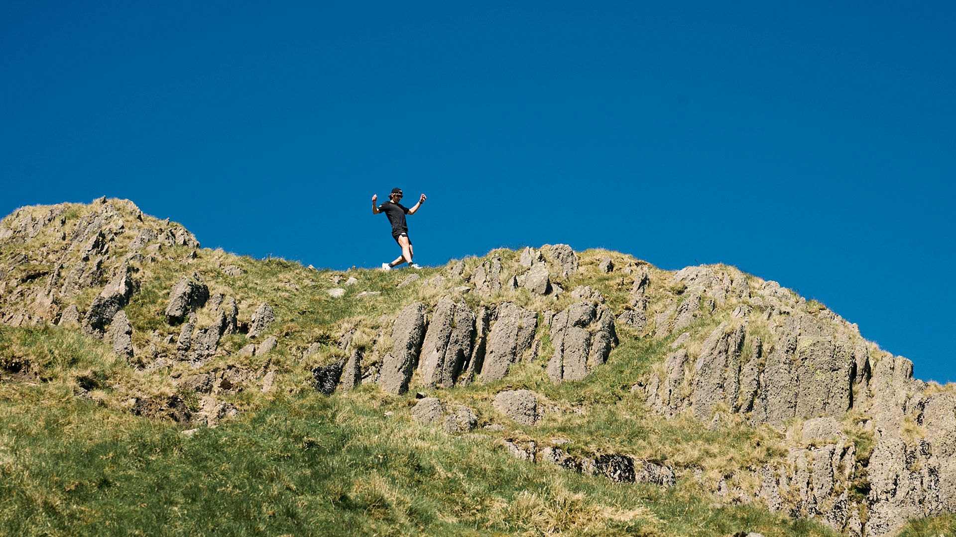 Josh wade running across rocks