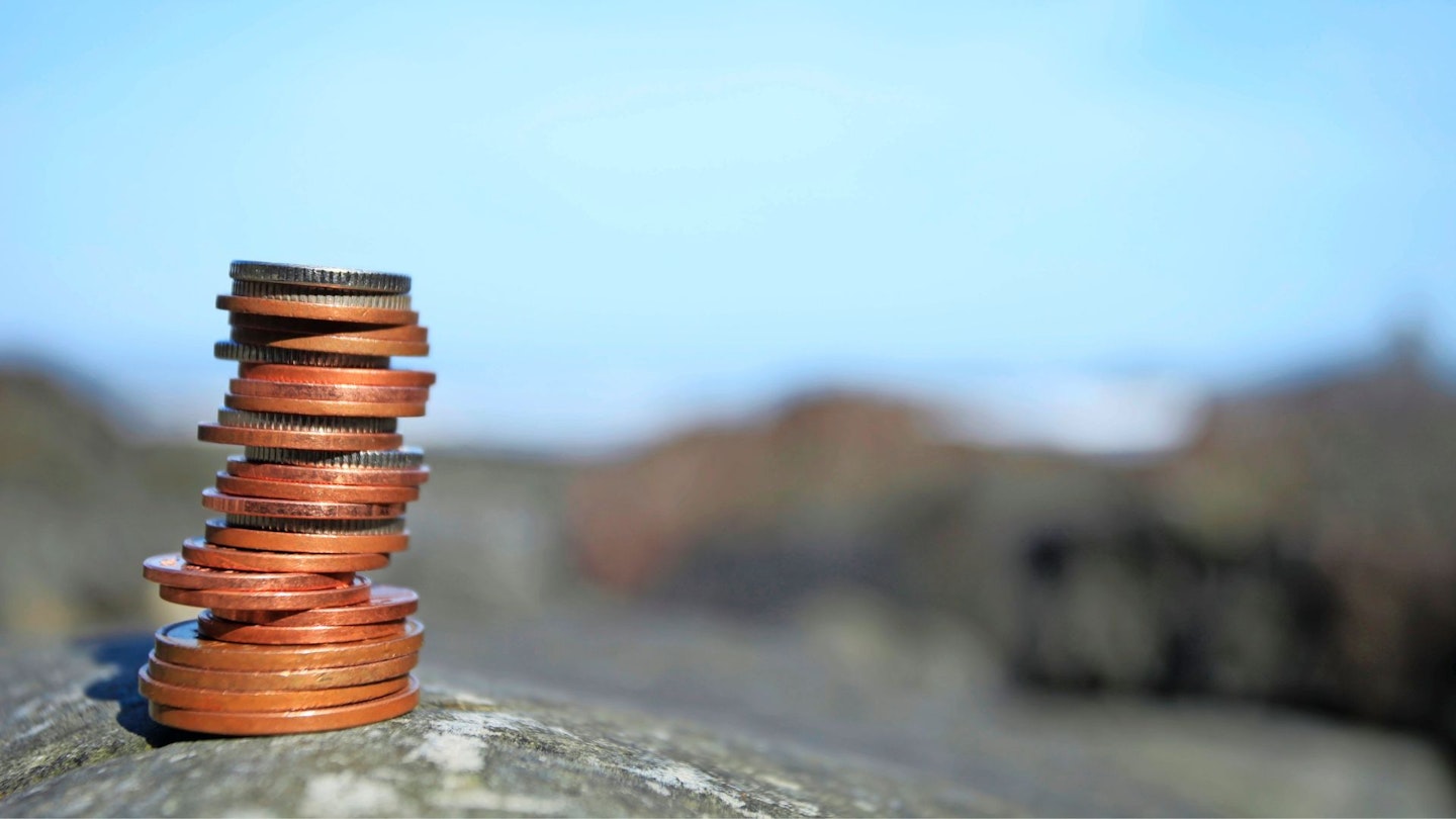 Pile of coins on a mountain