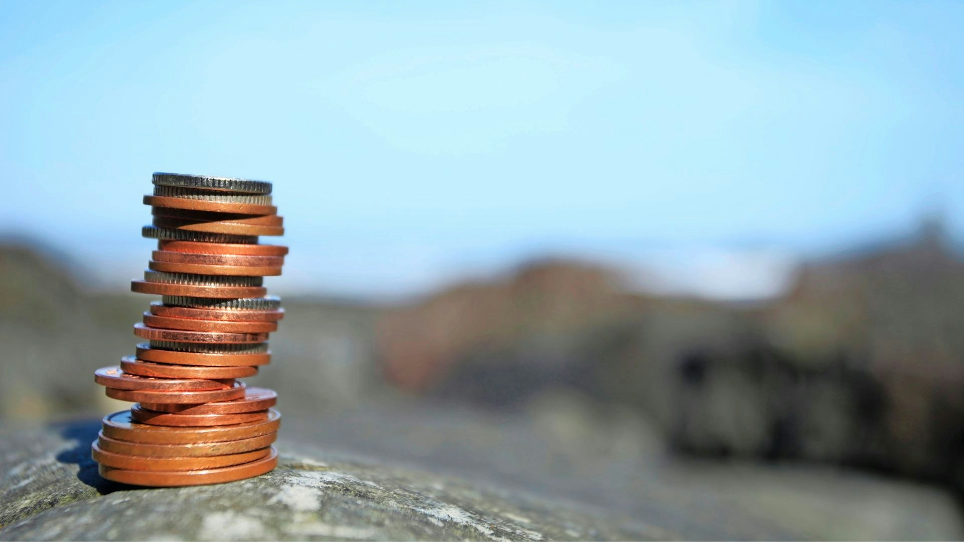 Pile of coins on a mountain