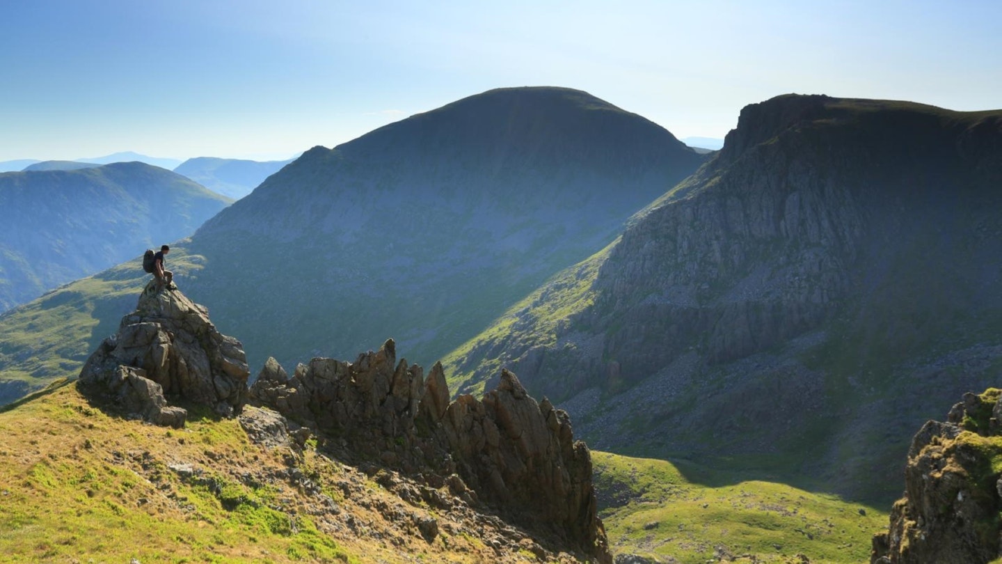 Hiker looking to Pillar from ridge on Steeple