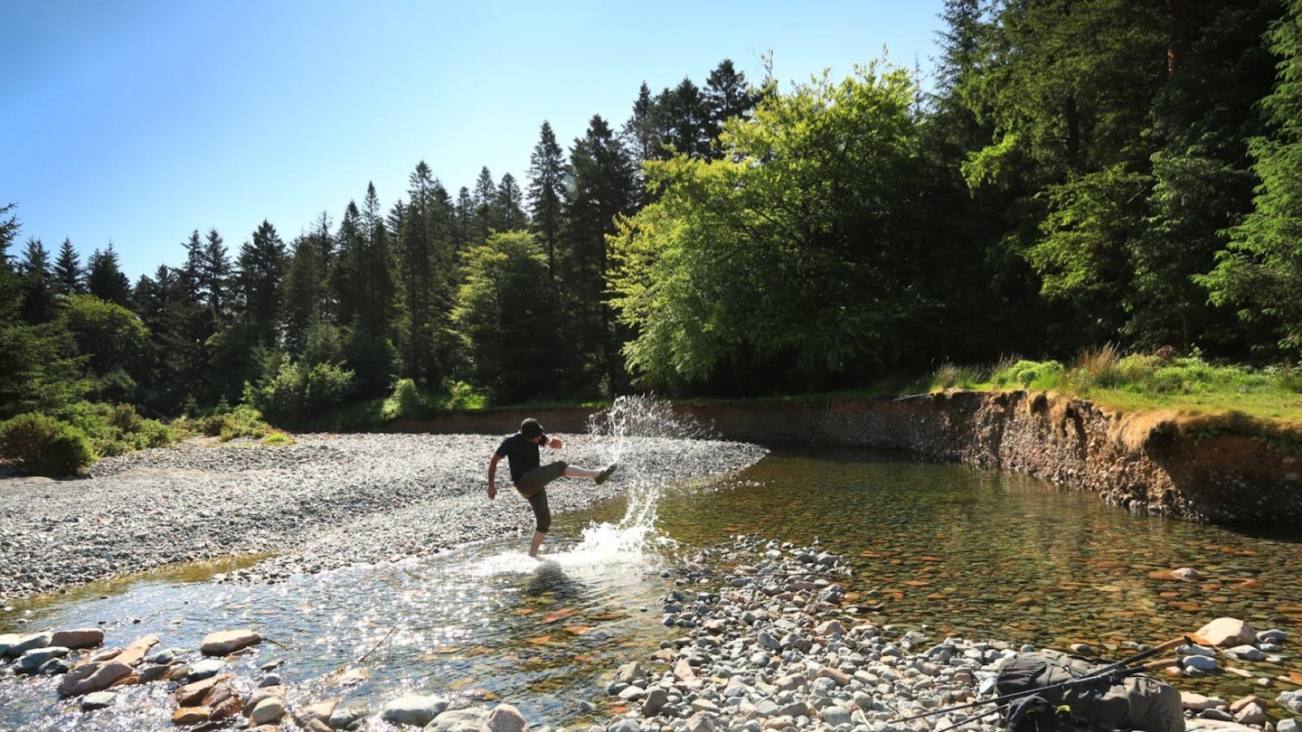 Hiker cooling off in the River Liza Ennerdale