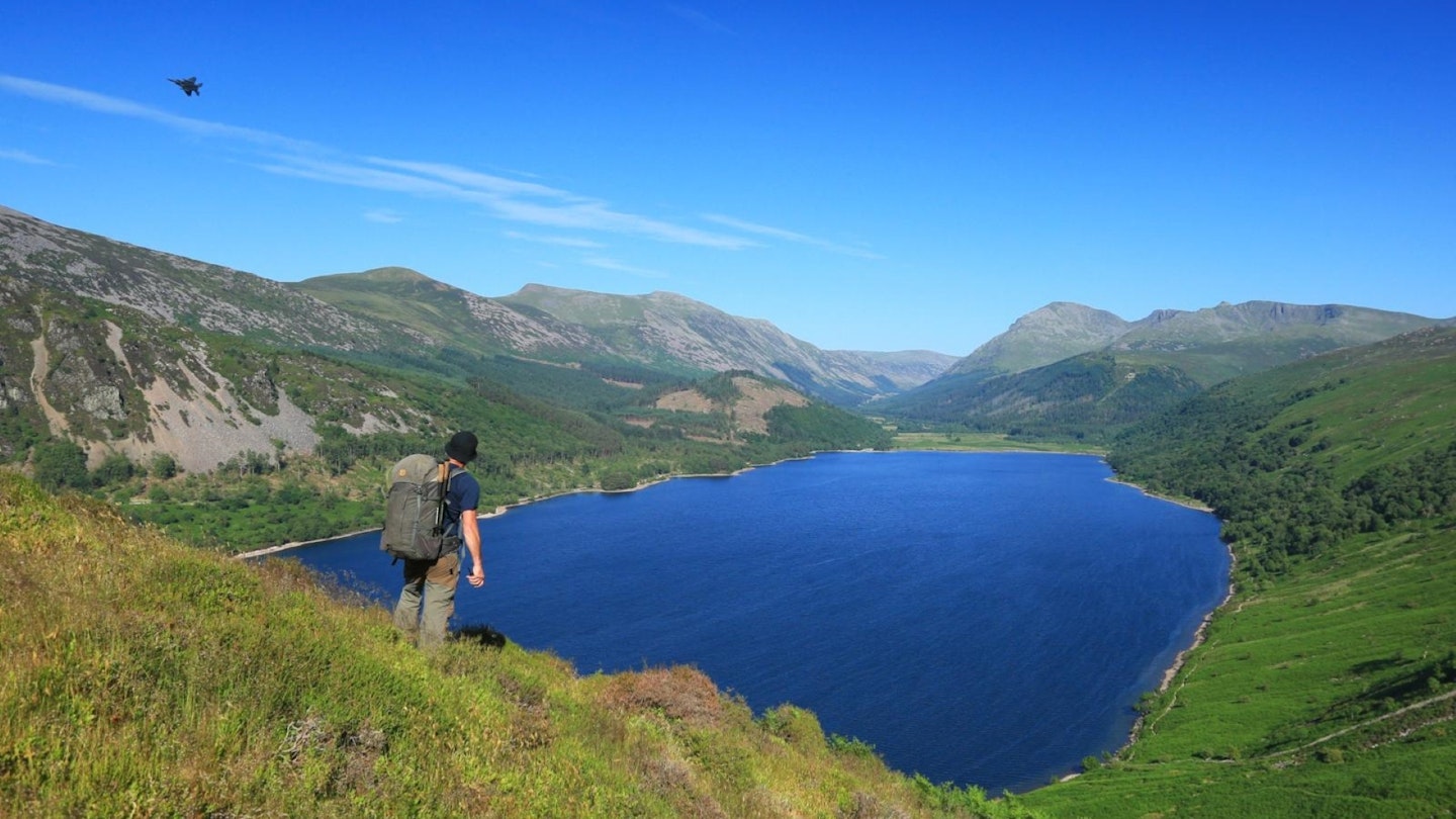 A jet pierces the deep blue sky of the Ennerdale valley