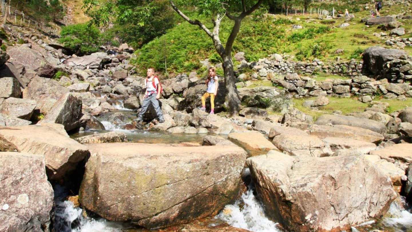 Two kids hiking over Stickle Ghyll Langdale Lake District