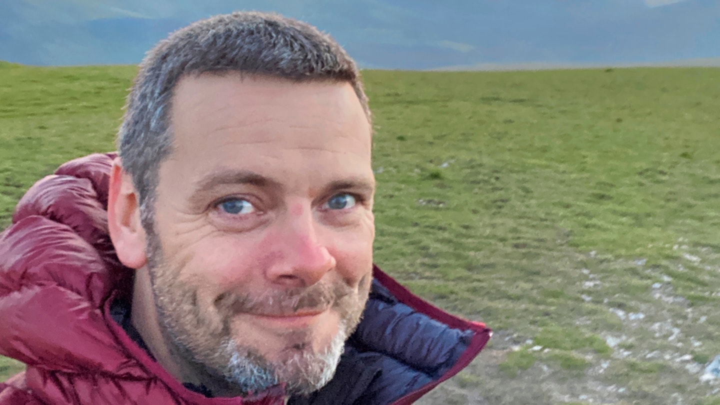 Author Nick smiling with content after his wild camp