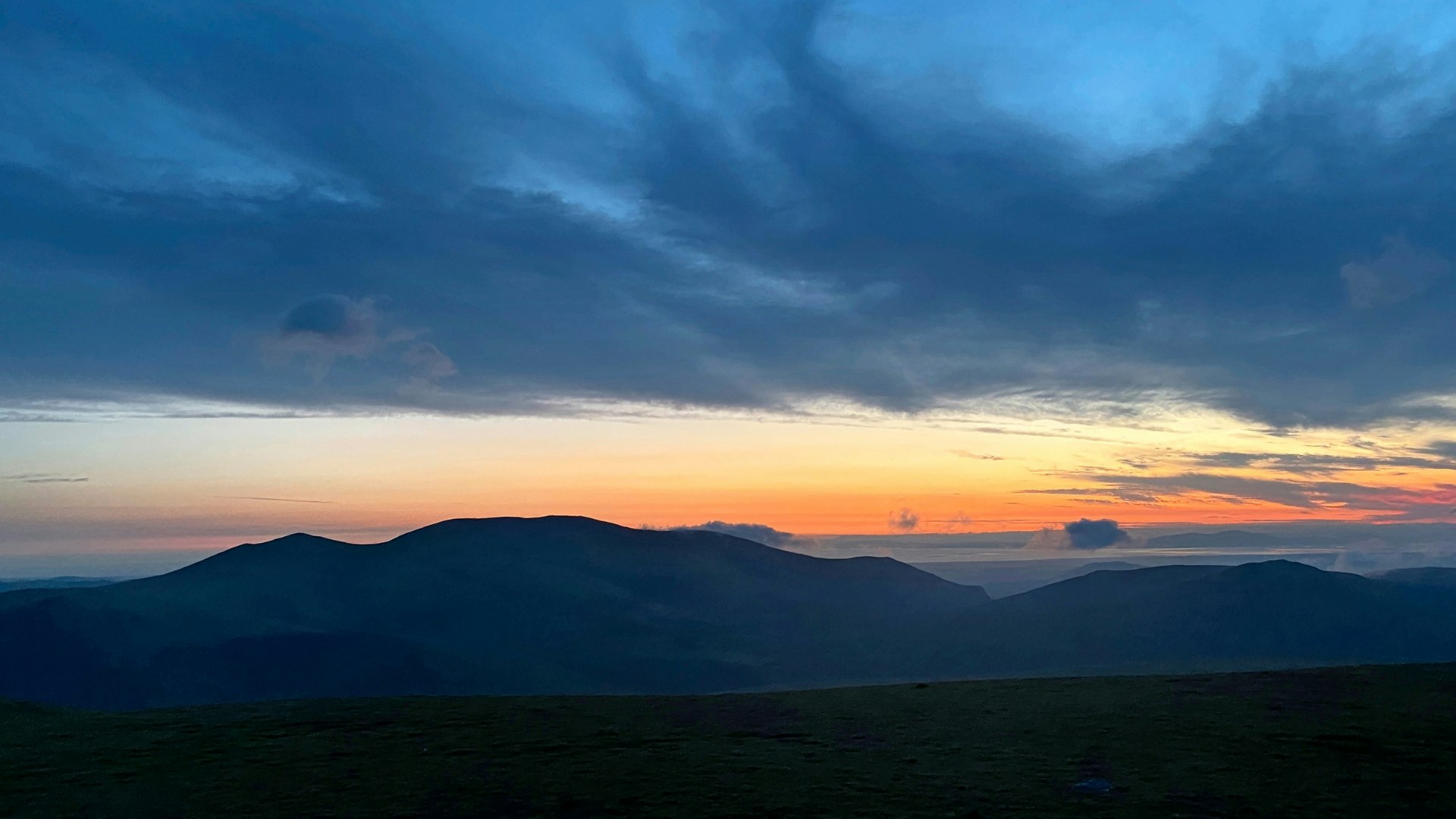 Watching the sun rise from camp on Blencathra
